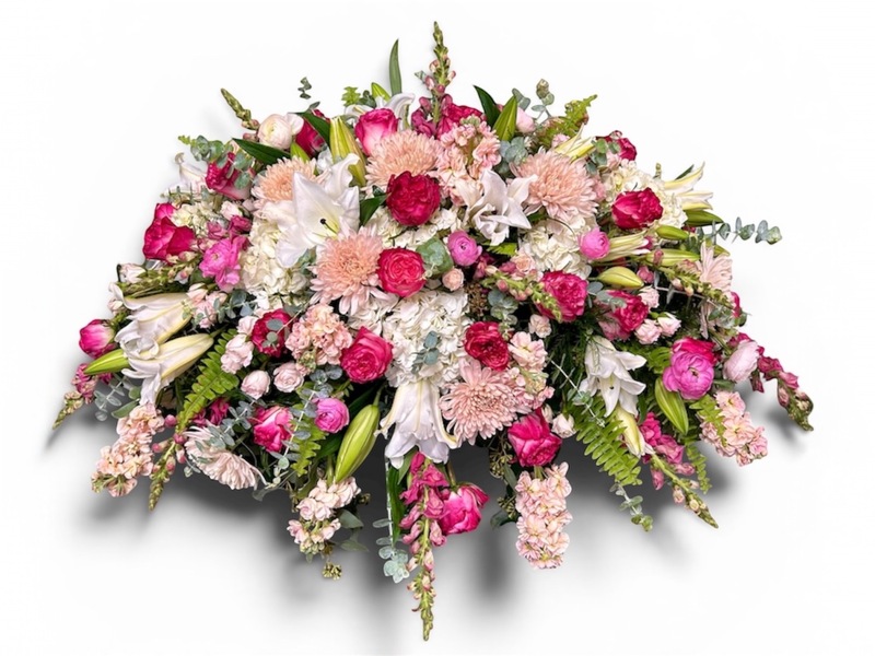 Lovely Pink and White casket Cover  from Carl Johnsen Florist in Beaumont, TX