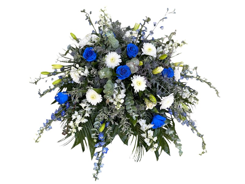 White & Blue Rose Casket Spray from Carl Johnsen Florist in Beaumont, TX