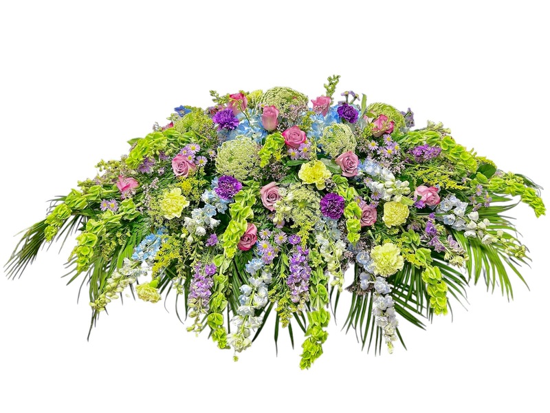 Purples, Blues & Green Casket Cover from Carl Johnsen Florist in Beaumont, TX